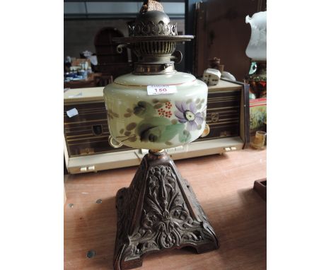 An art nouveau copper based oil lamp with hand painted glass and enamel decoration serial number 18770
