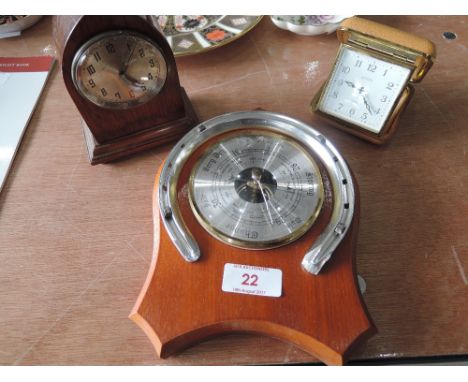 A small oak mantle clock, a travel clock and modern barometer