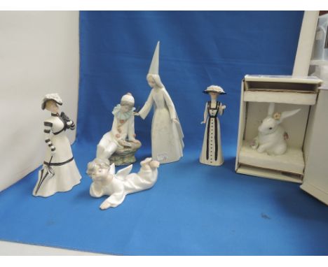 Three Lladro figures, Female Wizard, Angel and a Rabbit, A Nao figure, Clown and Two Wedgwood figures, Penelope & Amelia