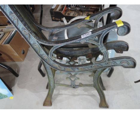 A pair of metal bench ends