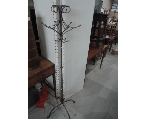 A modern wrought frame coat/hat stand