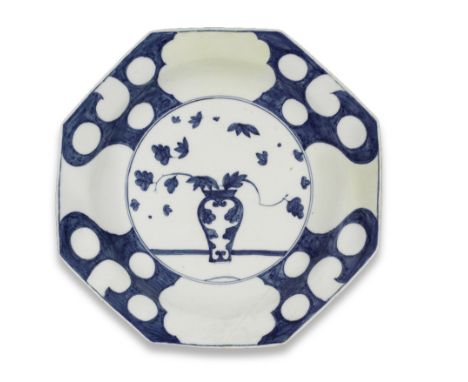 A very large and unusual Meissen octagonal dish, circa 1740Painted in underglaze-blue with a vase on a ledge containing leafy