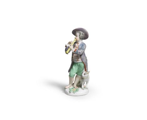 A Meissen later-decorated figure of a boy with a dog, the porcelain circa 1750Playing the flute and wearing a blue patterned 