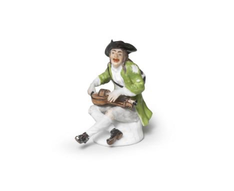 A Meissen figure of a beggar playing the hurdy-gurdy, circa 1745Modelled by J.J. Kaendler, wearing ragged clothes consisting 