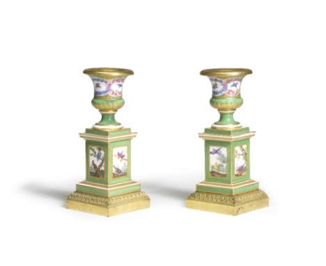 A pair of Sèvres green-ground gilt-metal mounted small vases, circa 1768-69Each with a square pedestal section reserved on ea