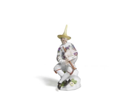 A Meissen figure of a bagpipe player, mid 18th centuryWearing a yellow hat, jacket with flowers and white breeches with red b