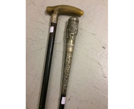Indian Malaca walking stick with white metal top and a horn handled walking cane