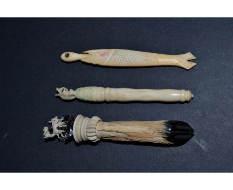 Animals: Three Needlework Items to include a screw-top bone needle case topped with a squirrel eating a nut; another such ite