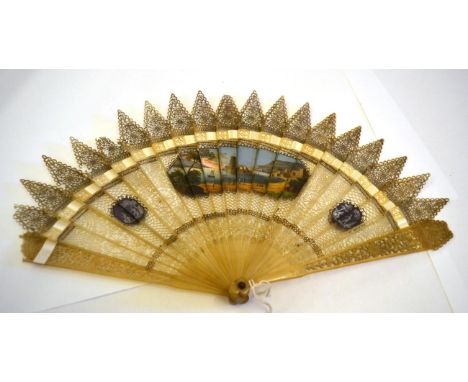 An Early 19th Century Gothic Horn Brisé Fan, the stick tips pointed and the head a trefoil shape. Very finely pierced sticks,