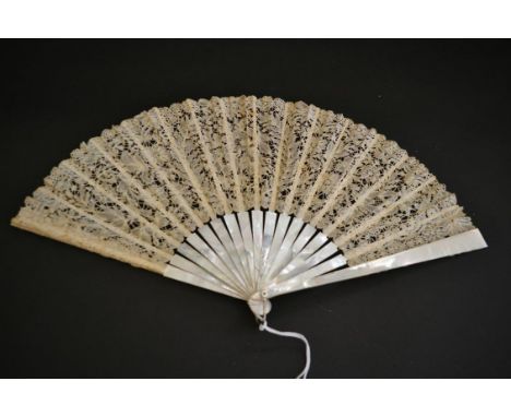 A Good Late 19th Century Brussels Bobbin Lace Fan, the guipure lace mounted on a sturdy white Mother of Pearl monture. A cent