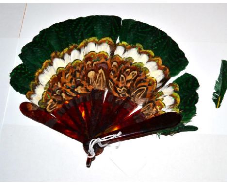 A Small Faux Tortoiseshell Feather Fan, most likely game bird feathers collected by the hunting party for their wives to have