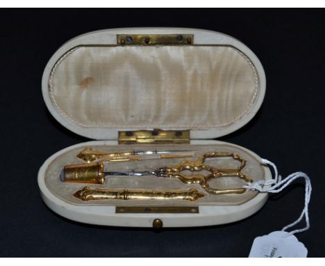 An 18ct Gold Sewing Set presented in an elegant oval ivory case, the lid lined in cream silk, the base in taupe velvet, shape