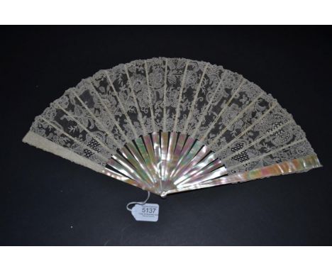 A Late 19th Century Medium Size Brussels Point De Gaze Needle Lace Fan, the monture of a bright and shiny slightly pink mothe