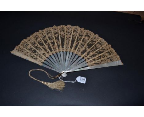 A Late 19th Century Plain White Mother-of-Pearl Fan, the deep leaf of Brussels Point de Gaze needle lace, worked centrally wi
