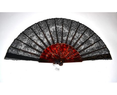 A Good Tortoiseshell and Black Bobbin Lace Fan, late 19th century, the monture with foliate design, both upper guards with a 