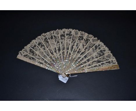 An Unusual Lace 19th Century Brussels Point De Gaze Lace Fan, the monture a soft pink mother-of-pearl, lightly carved, gilded