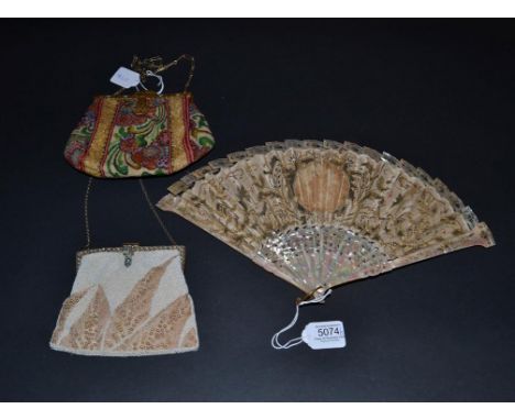 An Early 20th Century Fan with unusual pink mother-of-pearl monture, in that the top of all the sticks is T shaped. Lightly g