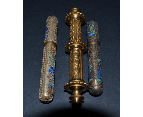 Three Gold Metal Needle Cases, two encased in filigree with blue and green enamel detail. The larger item, at 3.5 inches or 9