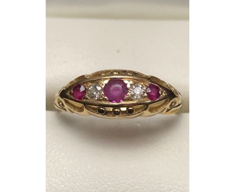 Vintage 18ct Gold Boat ring set with Ruby's and Diamonds in an ornate Gold setting size 'P'