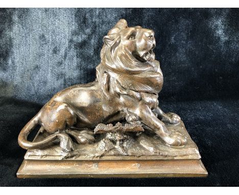 Bronzed lion inkwell with ornate pen holder with signature to base