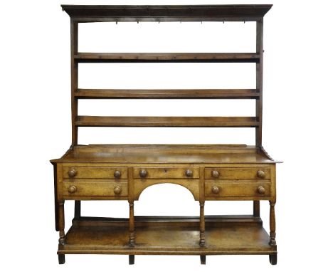 EARLY NINETEENTH CENTURY CILYCWM OAK HIGH DRESSER, CARMARTHENSHIRE, open delft rack with hand wrought iron hooks, on an open 