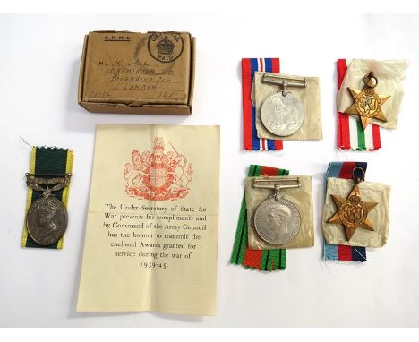 A medal group of six consisting of WWII 1939-45 and Italy stars, Defence and War Medals, together with George VI Efficiency M