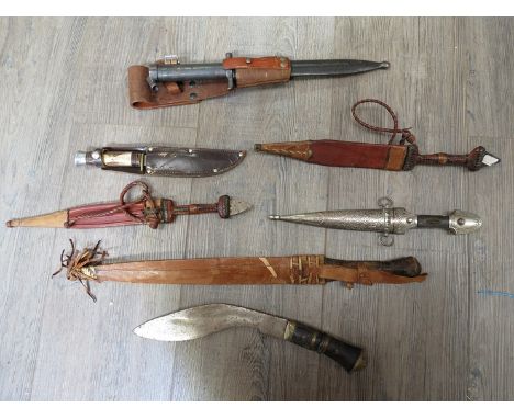 A quantity of mixed edged weapons including kukri and Swedish M96 bayonet with leather frog and scabbard