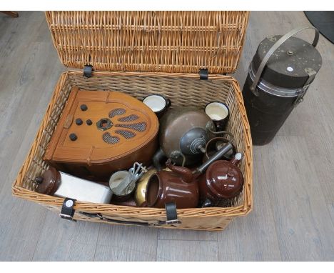 A wicker basket containing mock officer's mess kit/accessories including enamel teaset, primus, radio etc 