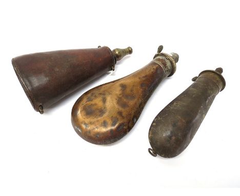 A 19th Century leather covered shot flask together with two powder flasks of plain form (3) 