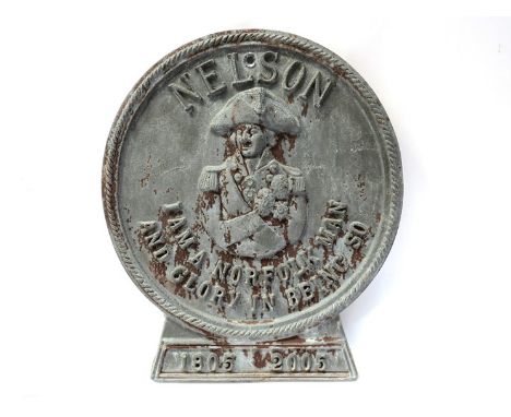 An Admiral Lord Nelson design lead wall plaque, central waist length portrait with "I am a Norfolk man and glory in being so"