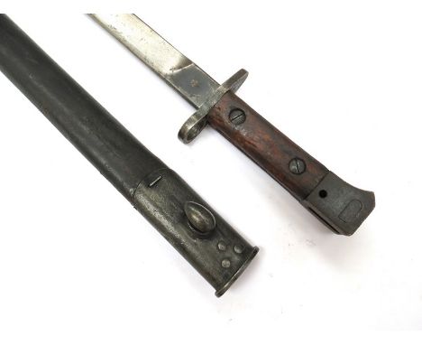 A British GRI Mk. II bayonet with RFI stamp (Rifle Factory Ishapore), dated 3 44 (March 1944), with steel mounted leather sca