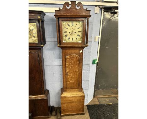 Georgian long case clock with unsigned floral painted dial, with an eight day movement, set in a oak case with arched pedimen