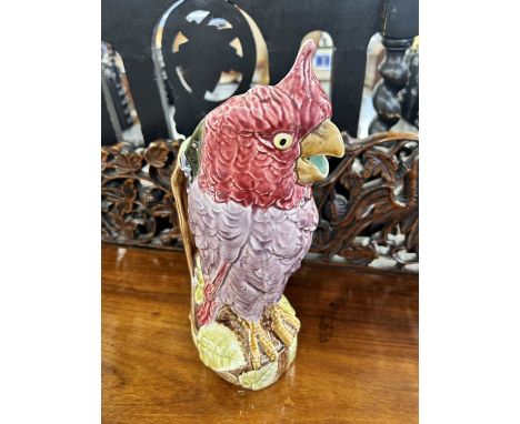 A vintage Majolica water jug in the form of a parrot