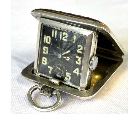 An Art Deco silver and rose gold cased folding purse watch with makers mark for SSM and dated 1933, the engine turned black d