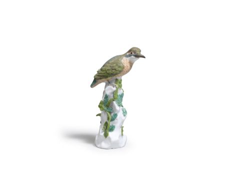 A rare Meissen model of a Kingfisher, circa 1740Modelled by J.J. Kaendler or J.F. Eberlein, perched on a high rockwork base a