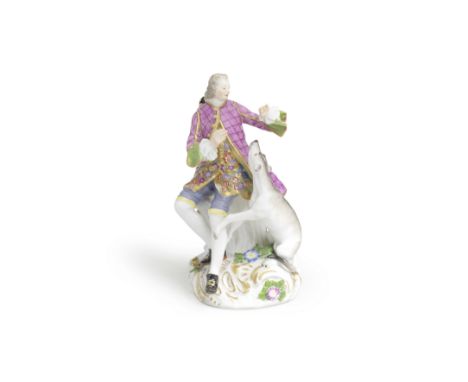 A Meissen later-decorated figure of a gentleman with a hound, the porcelain circa 1760Modelled by J.F. Eberlein with the gent