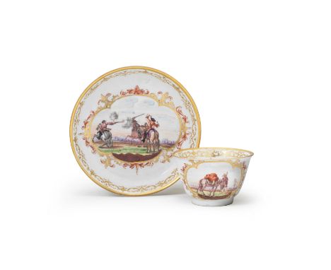 A Meissen teabowl and saucer, circa 1723The saucer painted with a military scene of figures on horseback within a gilt scroll