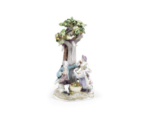 A Meissen group of the apple pickers, early 20th centuryAfter the model by J.J. Kaendler, depicting a boy in a tree picking a