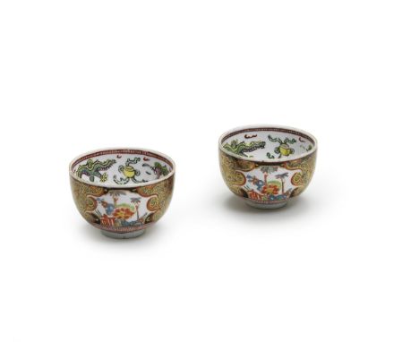 Two Meissen small bowls, mid 18th centuryEach decorated in underglaze-blue, enamels and gilding with three panels of Oriental