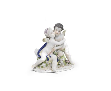 A Meissen group of Cupid and Psyche, mid 18th centuryCupid and Psyche seated on rockwork and embracing, Psyche with a blue cl