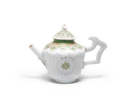 A rare Vezzi teapot and cover, circa 1725The body lobed and moulded with a circular panel on each side painted with a green a