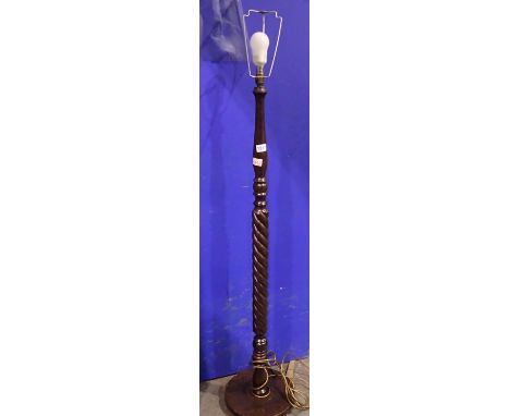 Mahogany standard lamp with twisted steam. All electrical items in this lot have been PAT tested for safety and have passed. 