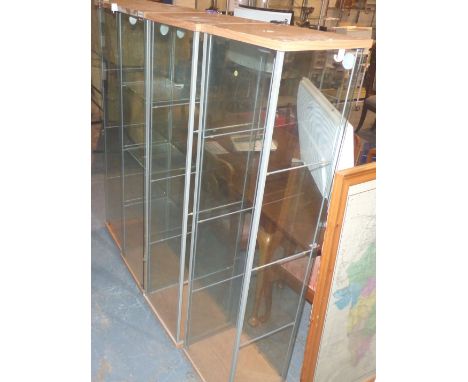 Four shelf glass display cabinets, 35 x 35 x 115 cm, lacking door. Not available for in-house P&amp;P 