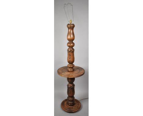 An Edwardian Carved and Turned Standard Lamp with Centre Shelf and Bulbous Acanthus Carved Support 