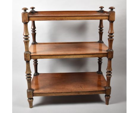 A Victorian Mahogany Three Tier Buffet with Galleried Top Shelf and Turned Supports. 86x46x102cms High 