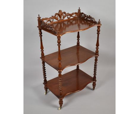 A Victorian Serpentine Front Three Shelf Rectangular Whatnot with Pierced Gallery and Turned Barley Twist Supports. 55.36x95c