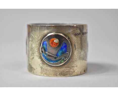 A Liberty and Co Cymric Silver and Enamel Napkin Ring, Having Three Circular Organic Motif Designs. Some Loss to Orange Ename