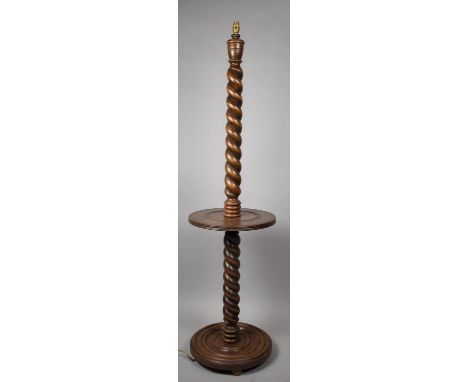 An Edwardian Oak barley Twist Standard Lamp with Centre Circular Shelf and Circular Plinth Base 