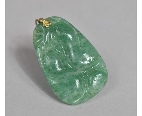 A Chinese Green Jade Carved Pendant with Gourd Decoration. 5cms High 