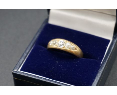 A Victorian yellow metal ring set five graduated diamonds, size P. 